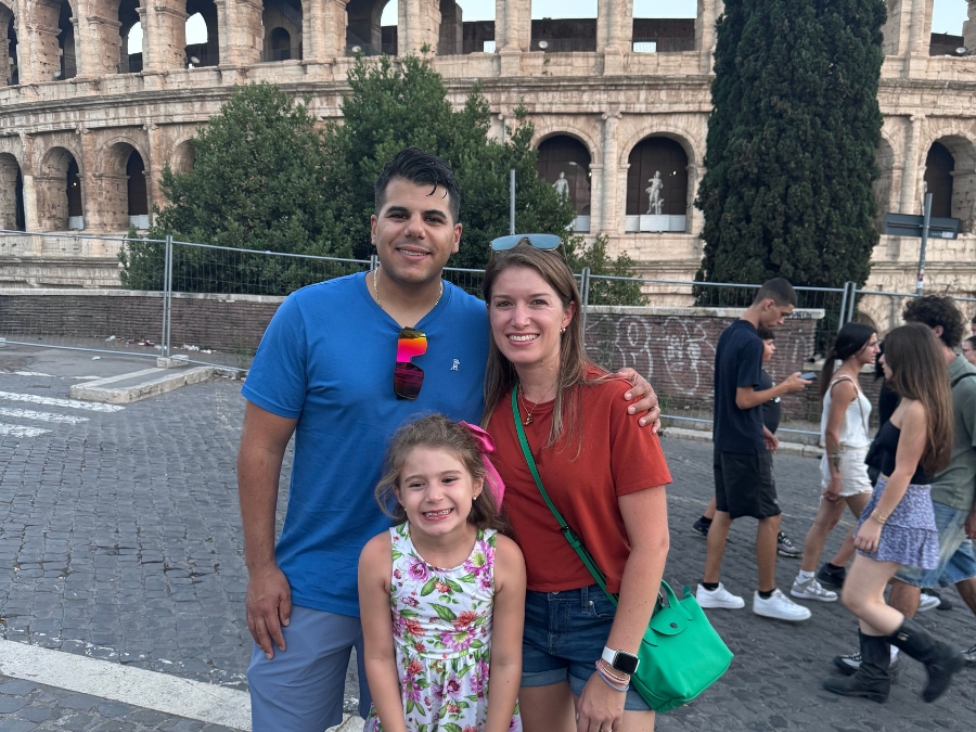 Fabiola Meneses with Happy Family Standing in Front of Roman Colosseum 