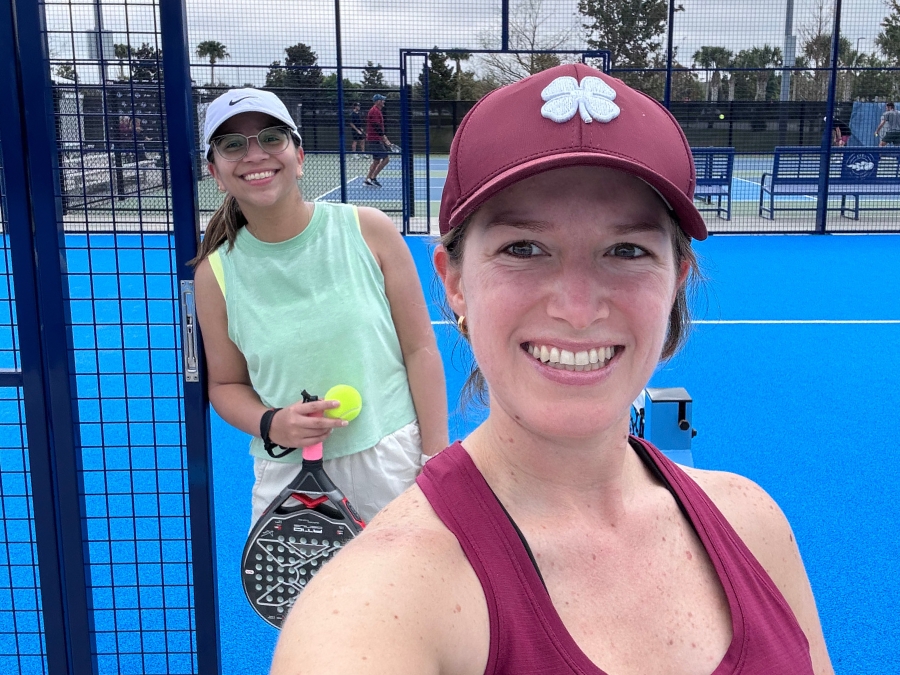 Fabiola Meneses smiling with friend playing Paddle