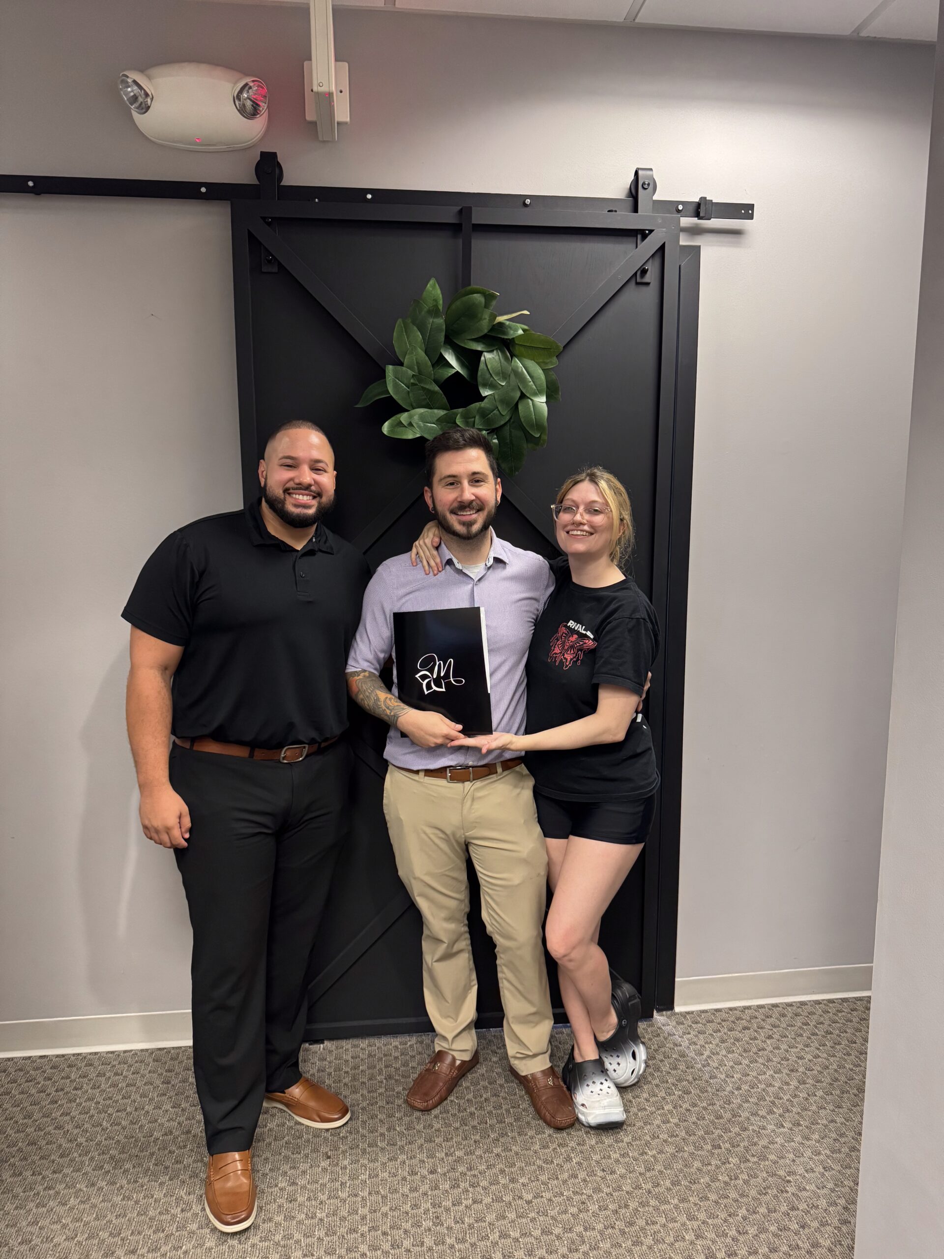 Alvin Abud Standing Smiling with two clients at closing