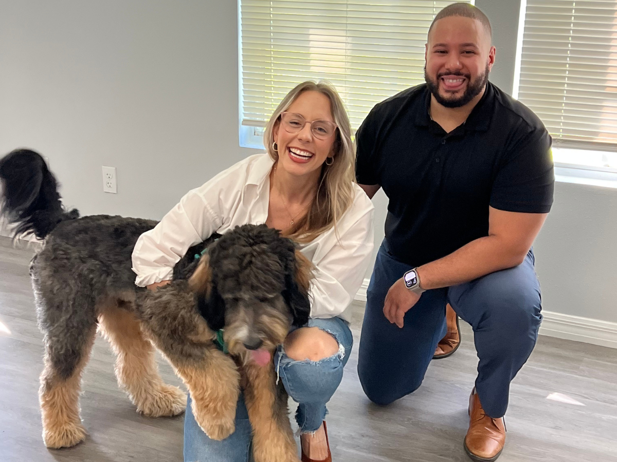 alvin abud with a female and her dog laughing at closing