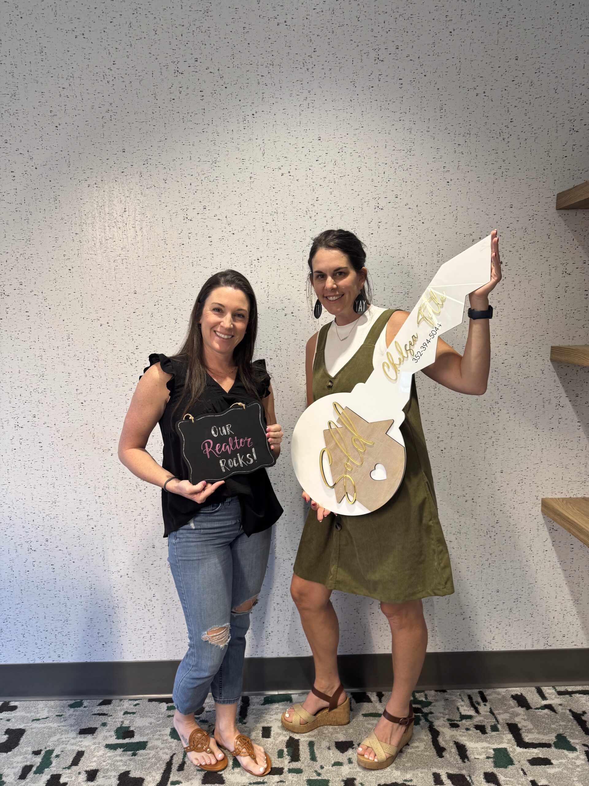 Jessica Remillard Smiling with Client at Closing Day Jessica Remillard smiling with female client at closing holding key in hand