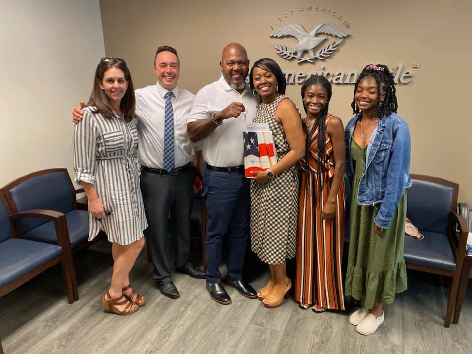 corey with clients at closing